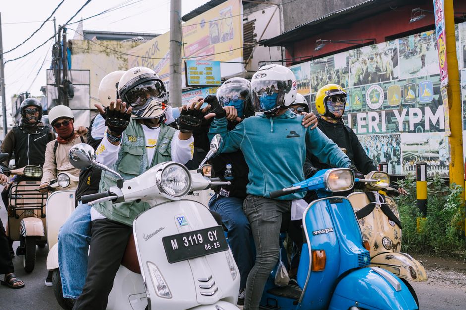 Gojek scooter driver in Jakarta, Indonesia, navigating city streets