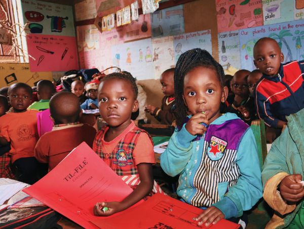 Children learning in a colourful classroom
