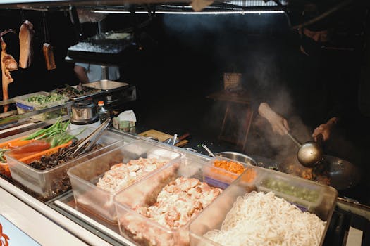 A bustling street food stall with diverse ingredients and a chef at work, capturing the essence of nightlife cuisine.