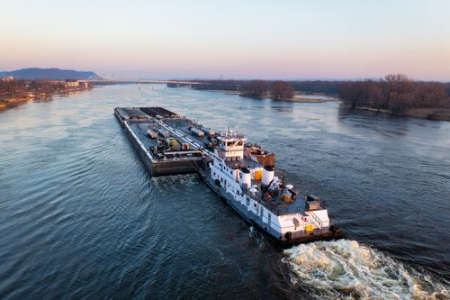 Free Aerial view of a barge on the Mississippi River near Wabasha, Minnesota, at dusk. Stock Photo