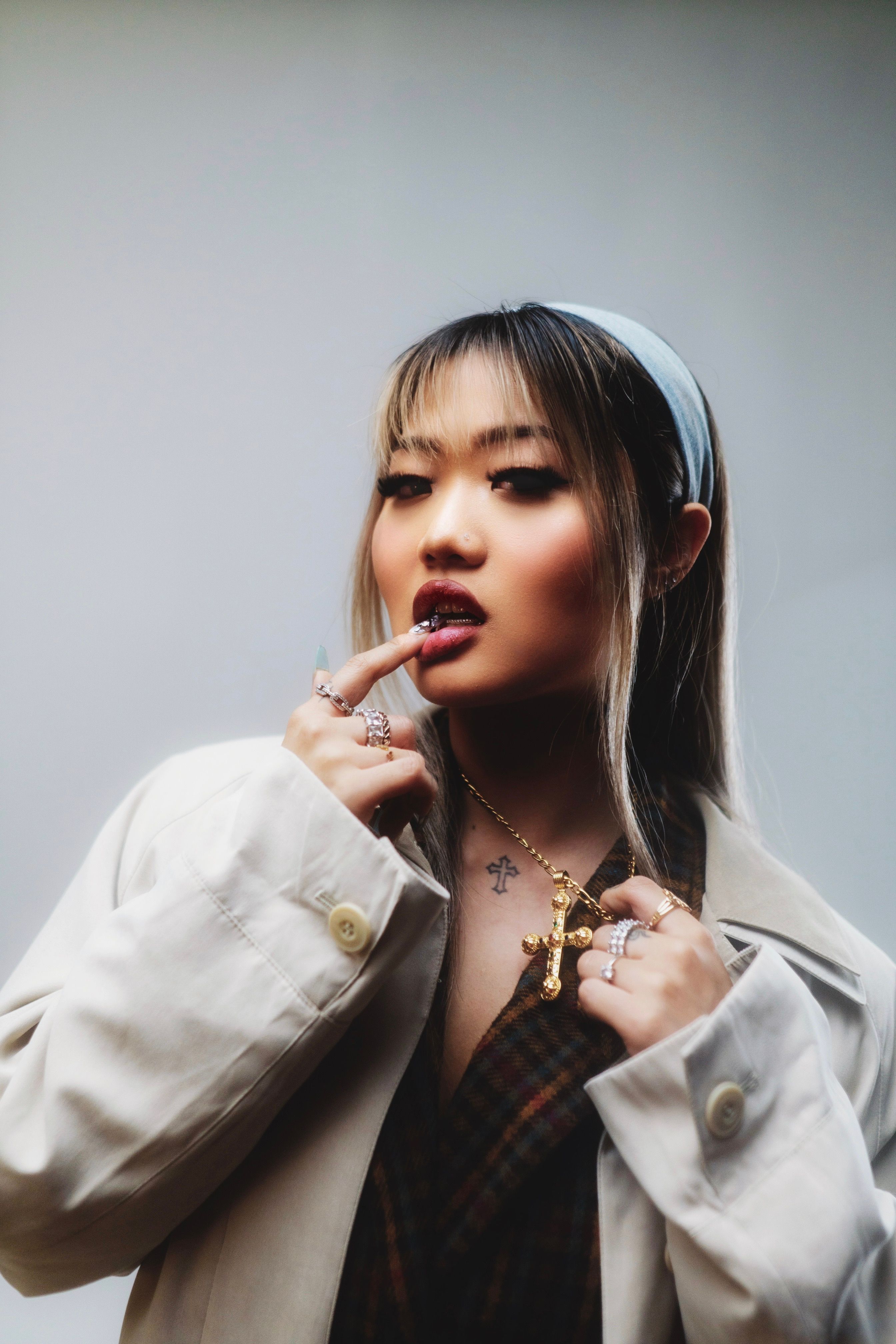 Elegant portrait of a fashionable woman with jewelry, highlighting Tokyo style.