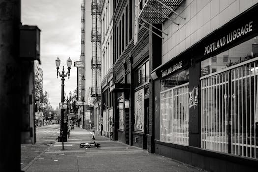 Black and white view of a tranquil street in Portland, Oregon, featuring urban architecture.