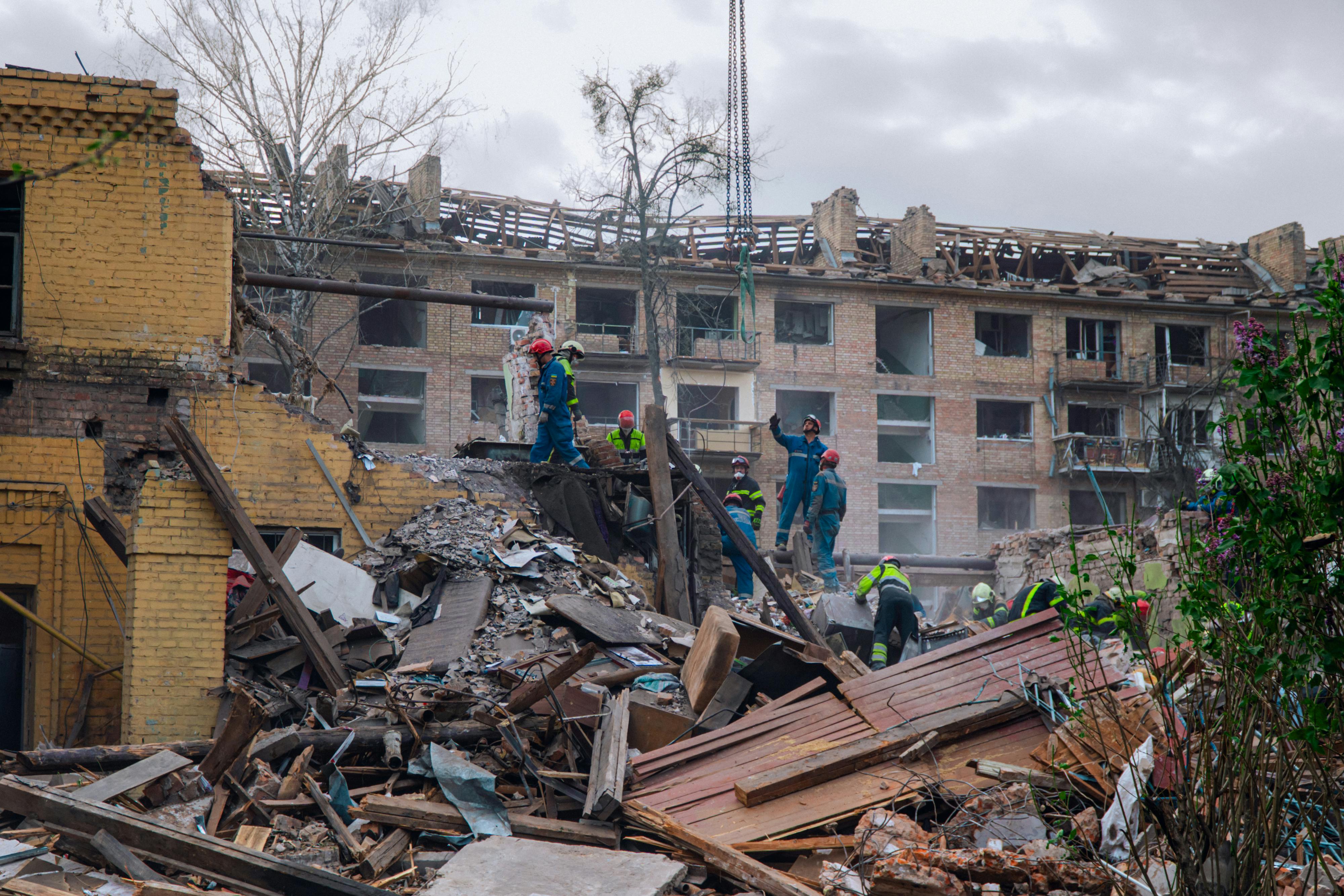 Firefighters navigate the destruction in Kyiv, Ukraine, showcasing bravery and resilience in wartime.