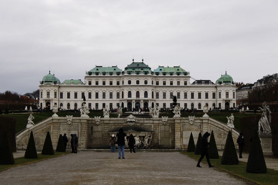 Elegant view of Belvedere Palace with statues and gardens in winter Vienna.