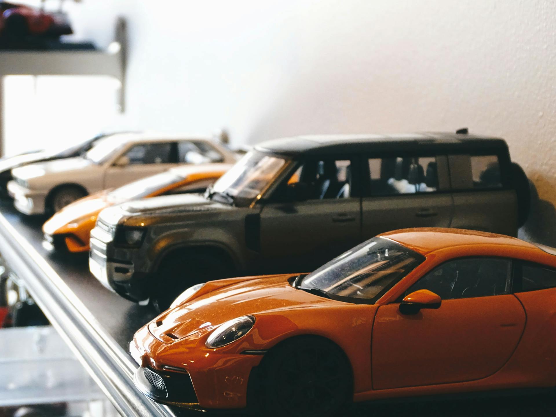 A detailed shot of model cars on a shelf, showcasing classic automotive design in Santiago, Chile.