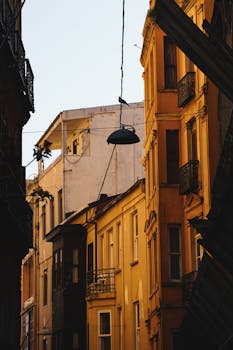 Sunlit view of historic European architecture showcasing rustic charm and warm tones.