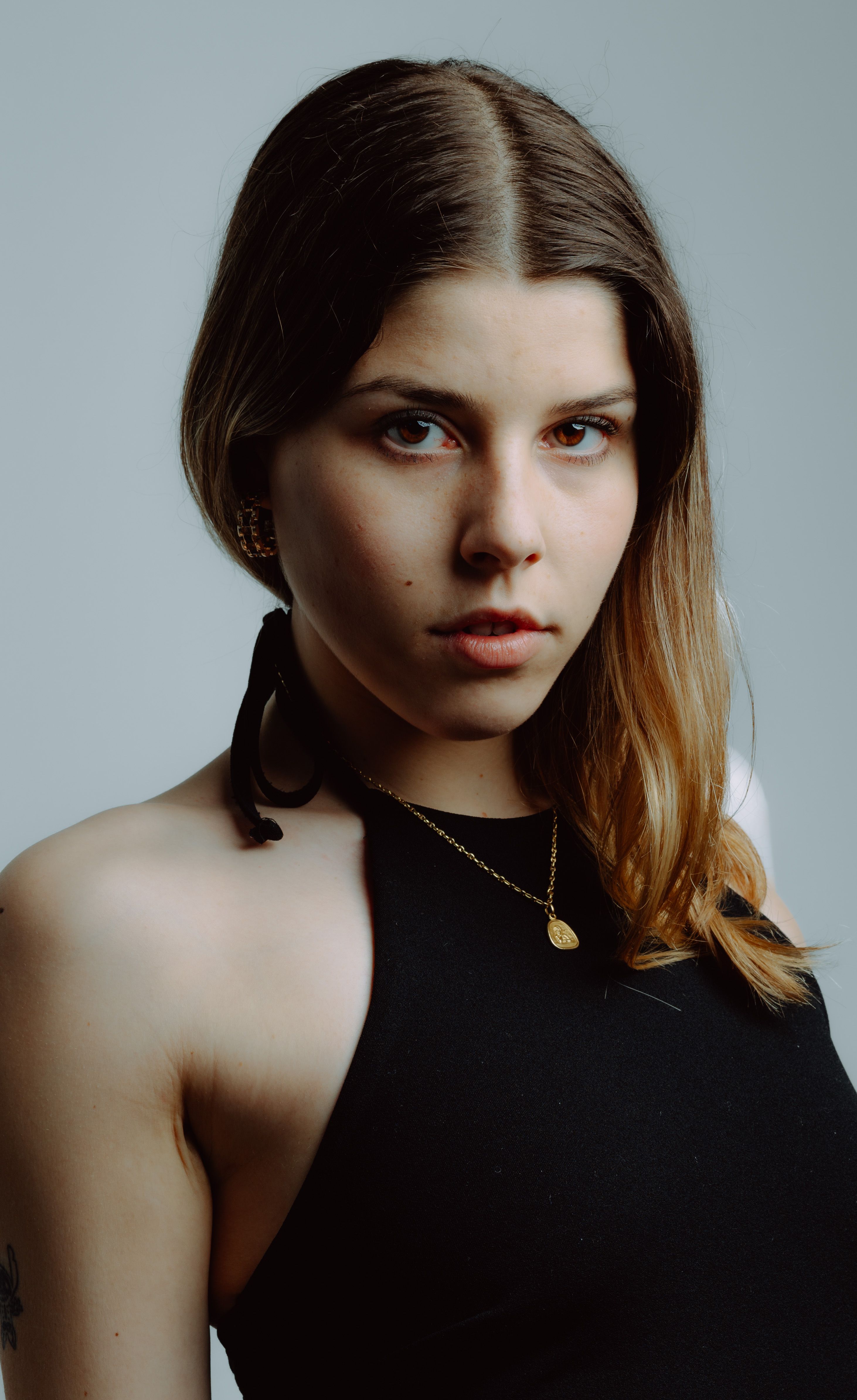 Portrait of a Young Woman with Intense Gaze · Free Stock Photo