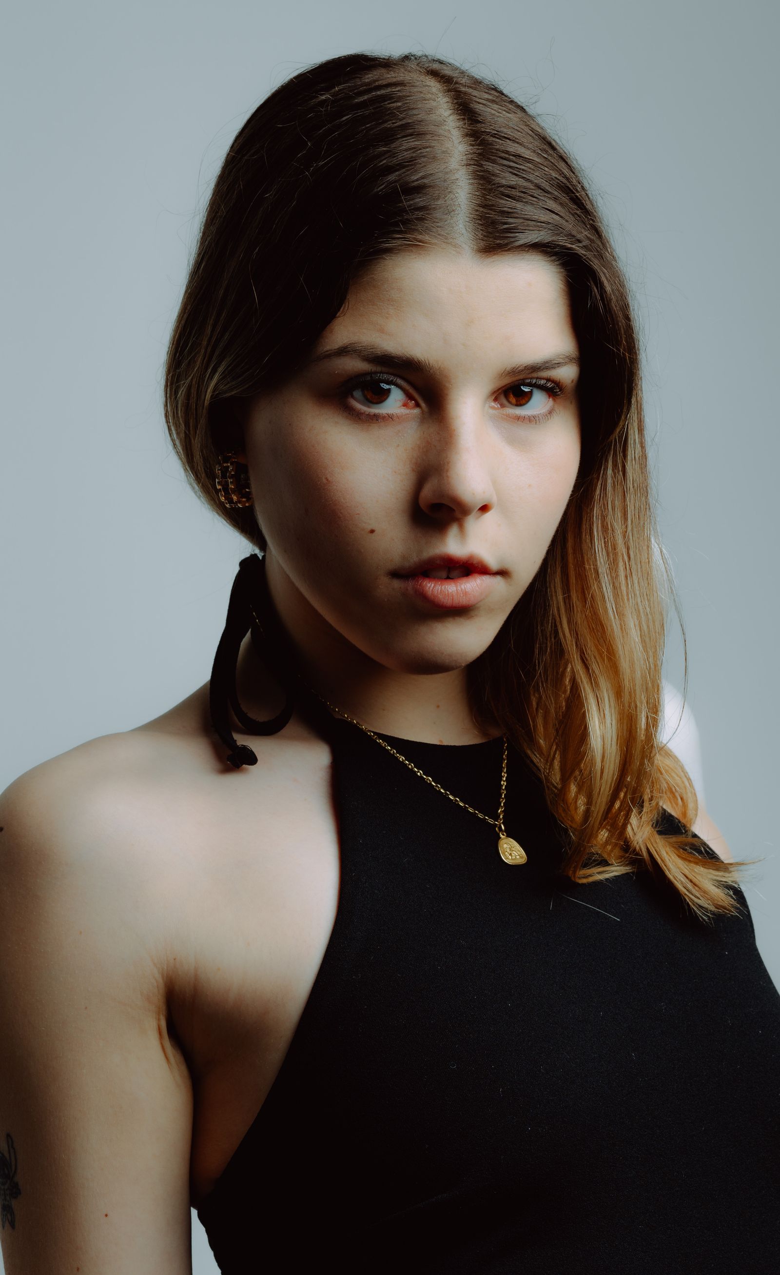Stylish Portrait of a Young Woman in Black Dress · Free Stock Photo
