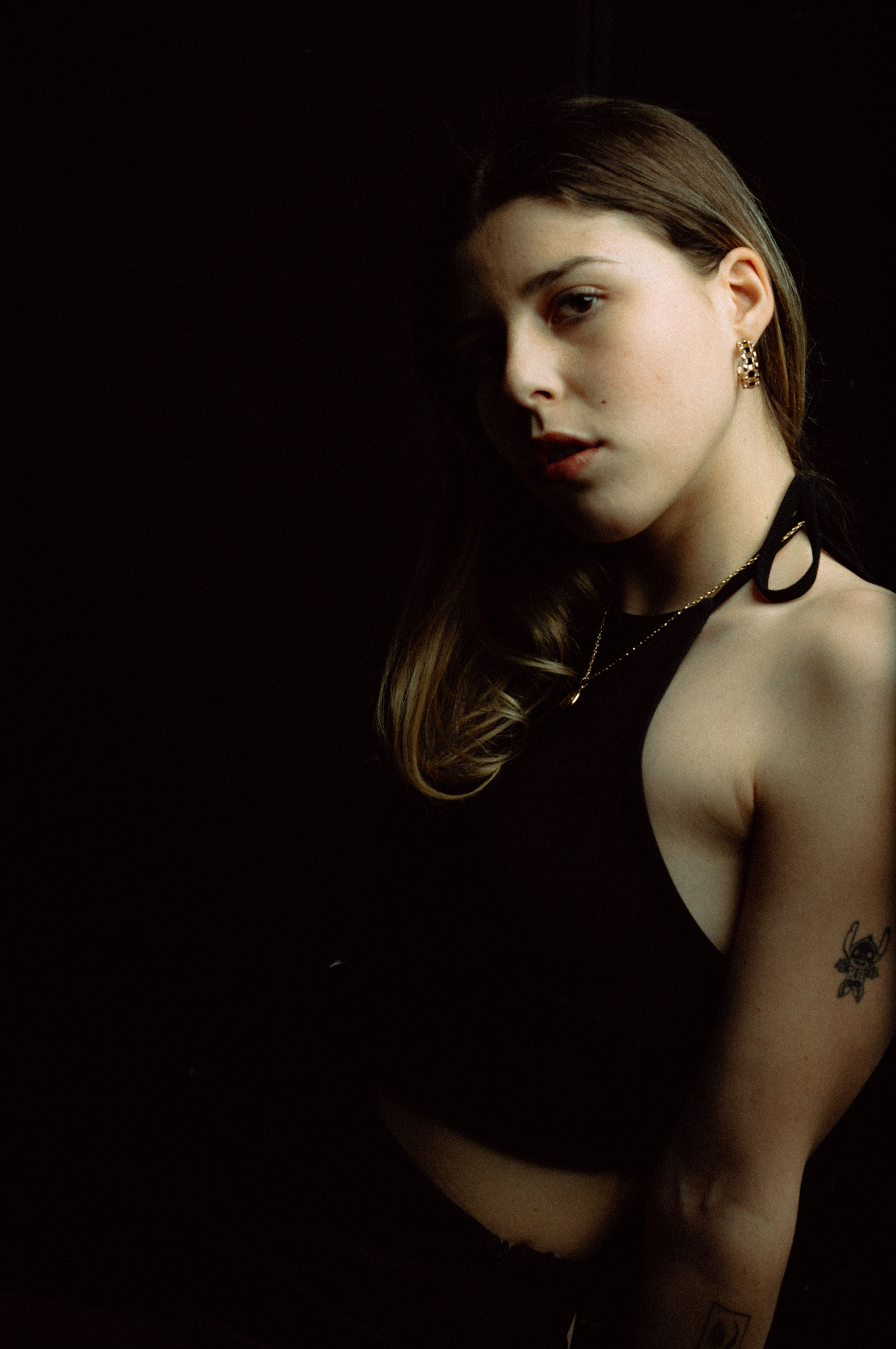 Portrait of a Woman in Dark Moody Lighting · Free Stock Photo