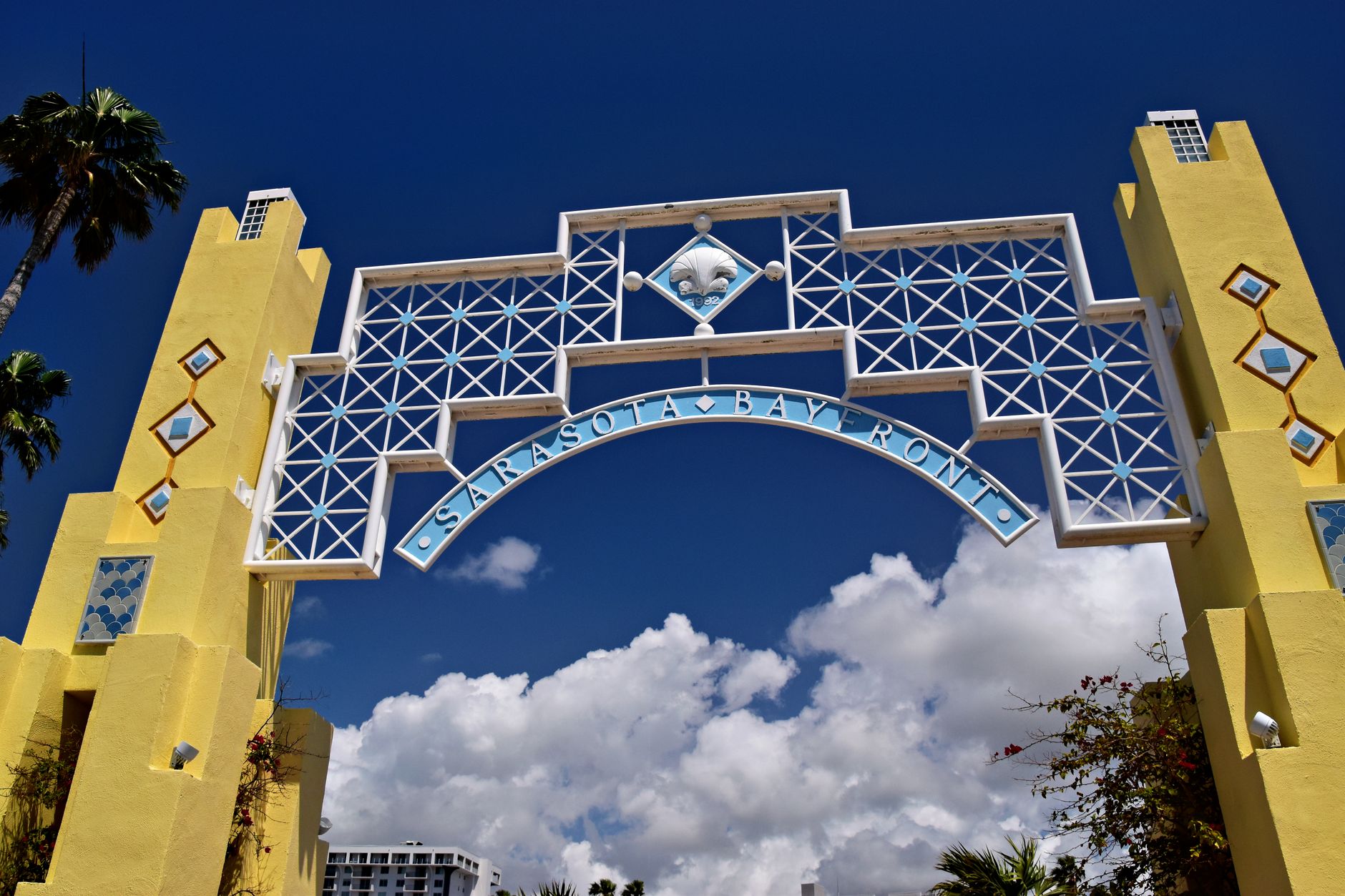 Vibrant archway at Sarasota Bay Front with a clear blue sky background.
