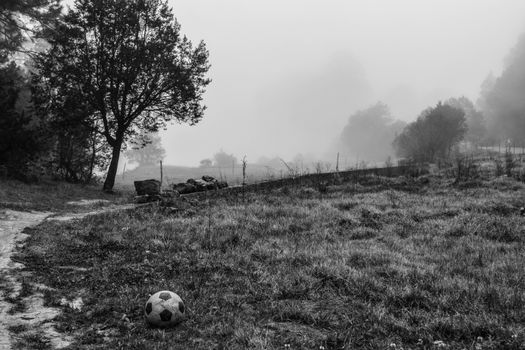 A serene foggy landscape with a soccer ball in San Joaquín, Querétaro, Mexico.