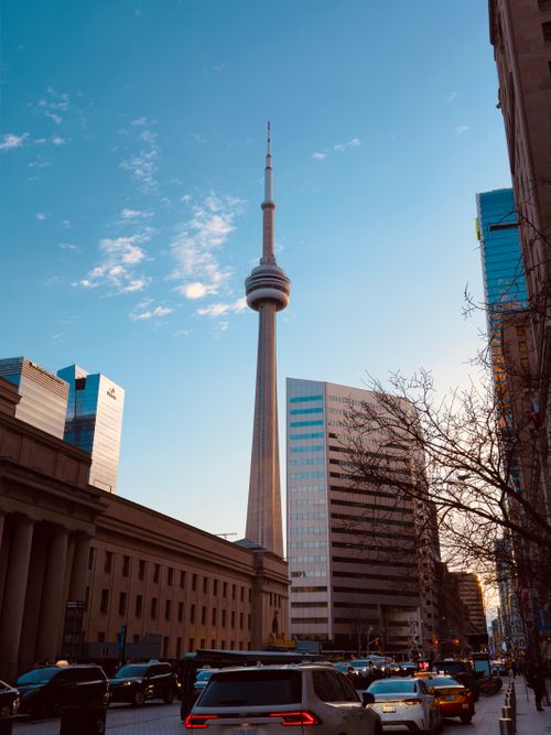 Free View of CN Tower with surrounding skyscrapers in downtown Toronto on a clear day. Stock Photo