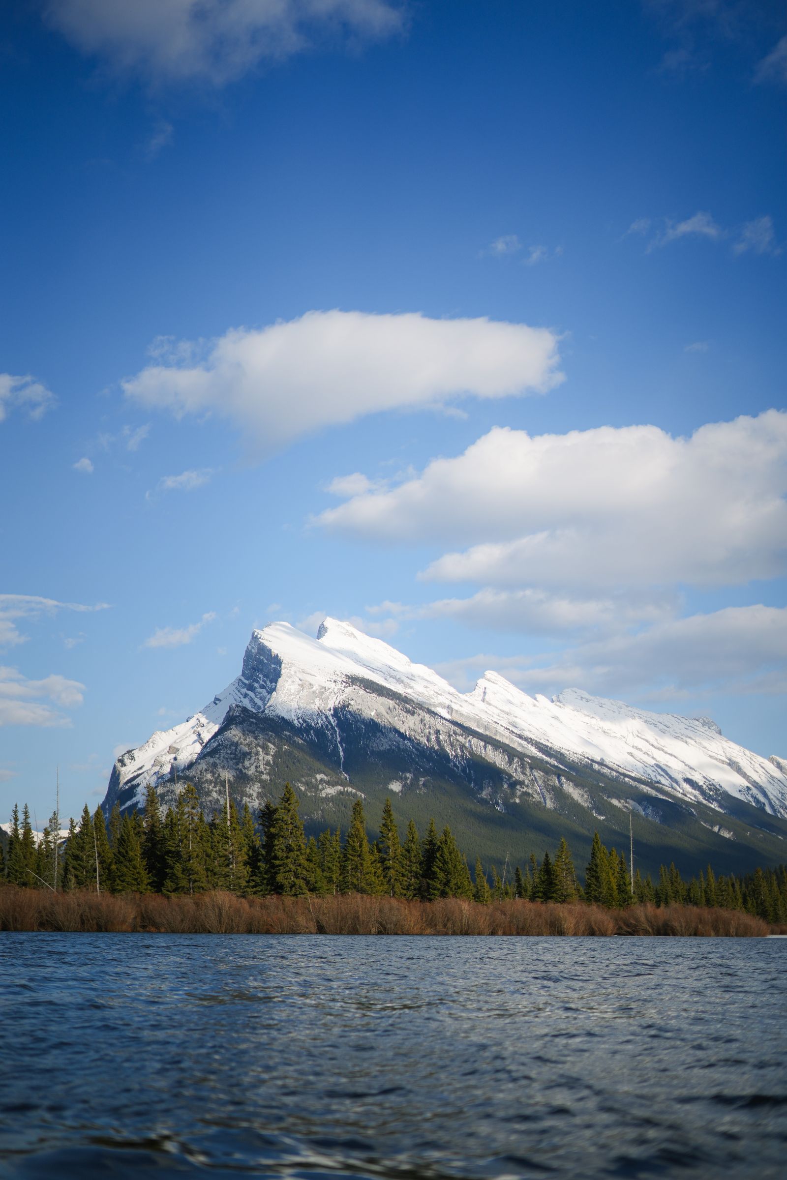Mount Rundle reflected in calm Vermilion Lakes water near Banff under a soft sky