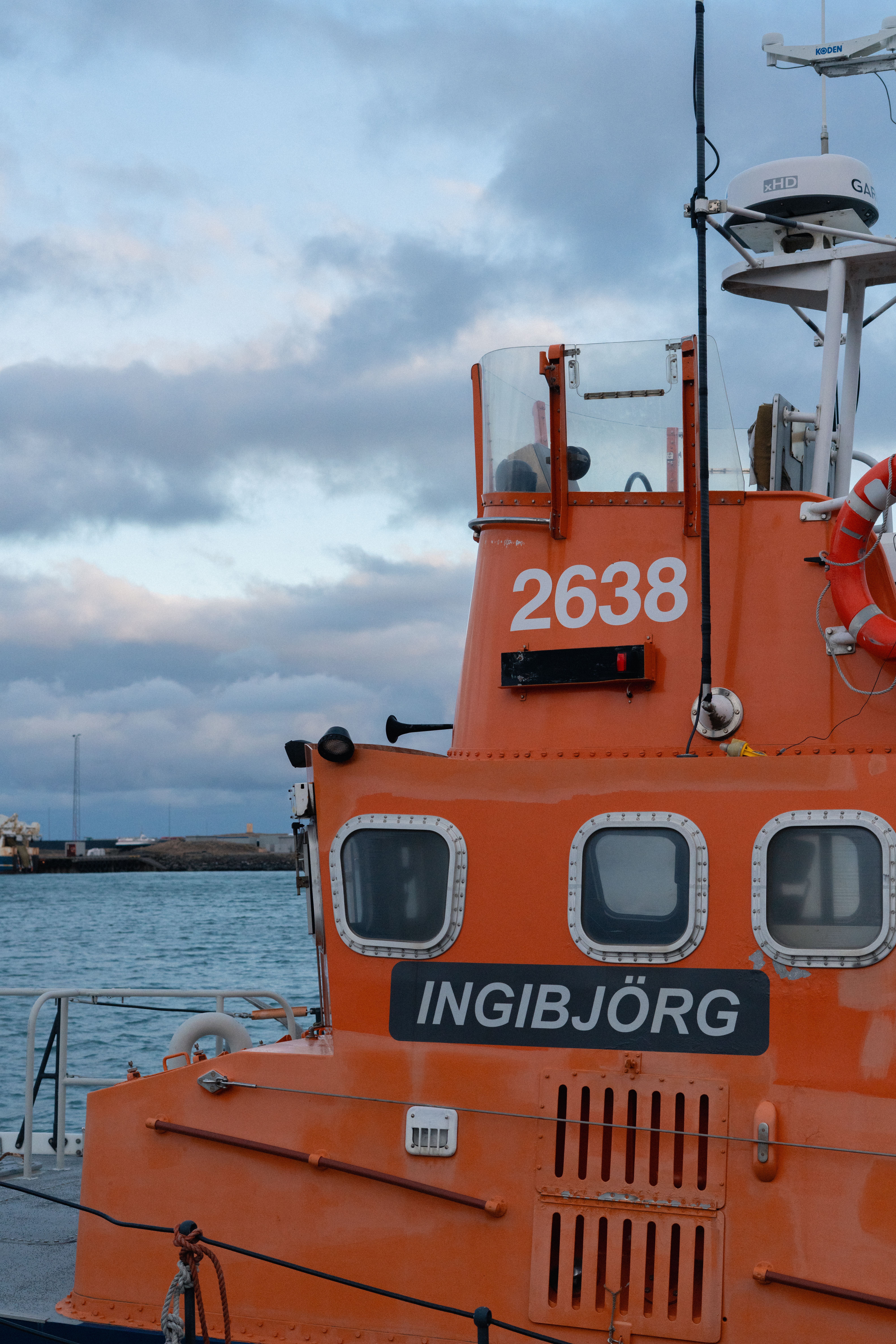 Orange Rescue Vessel Docked at Harbor · Free Stock Photo