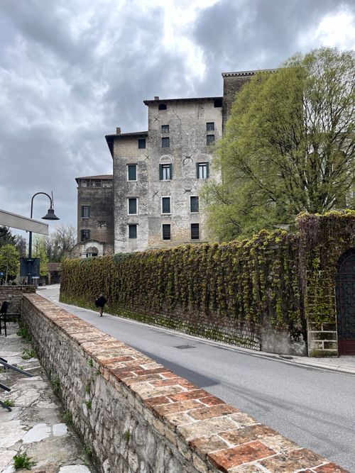 Free Charming historic building and stone wall in the Italian countryside under a cloudy spring sky. Stock Photo