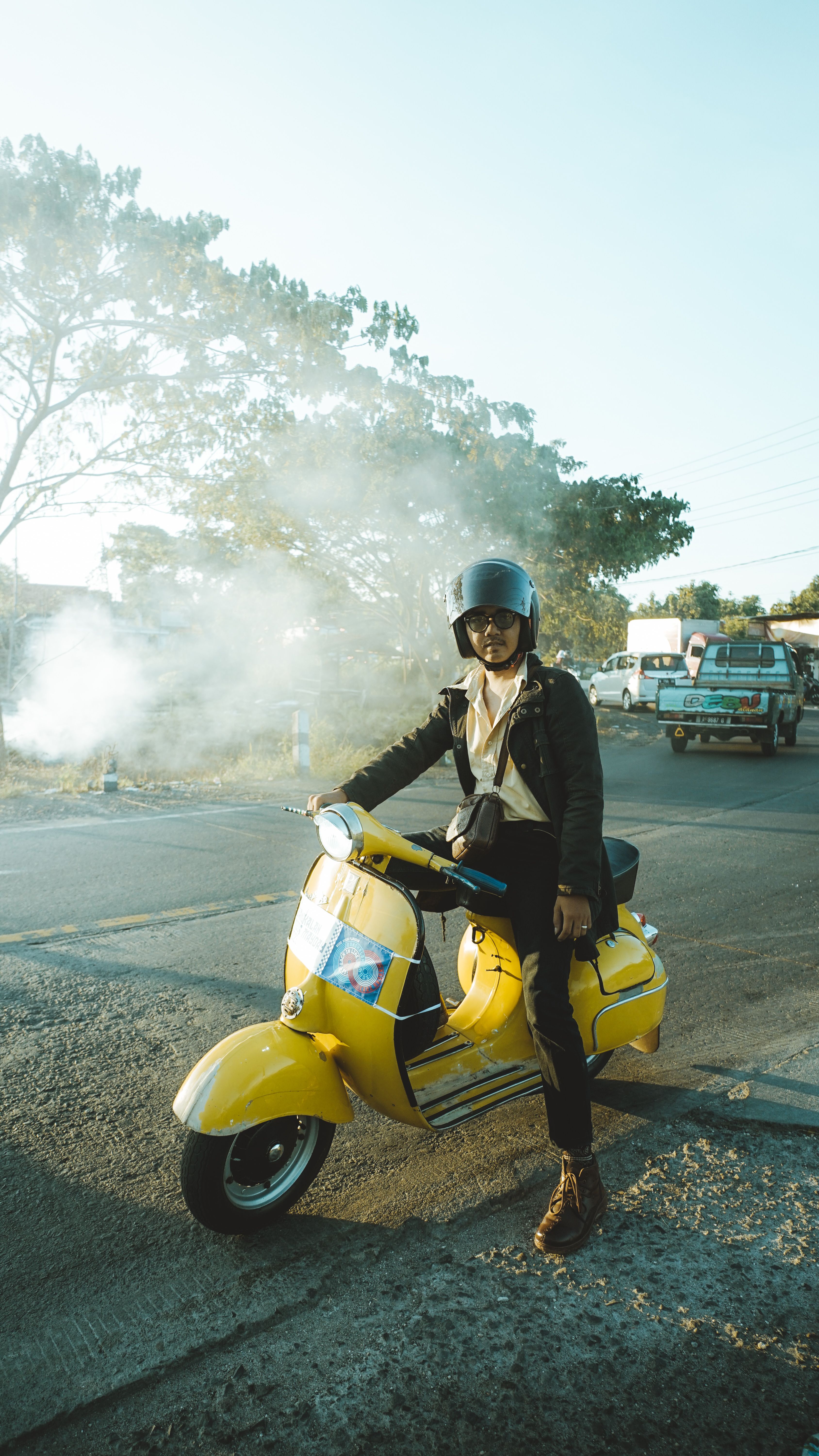Young Man Riding Yellow Vespa in East Java · Free Stock Photo