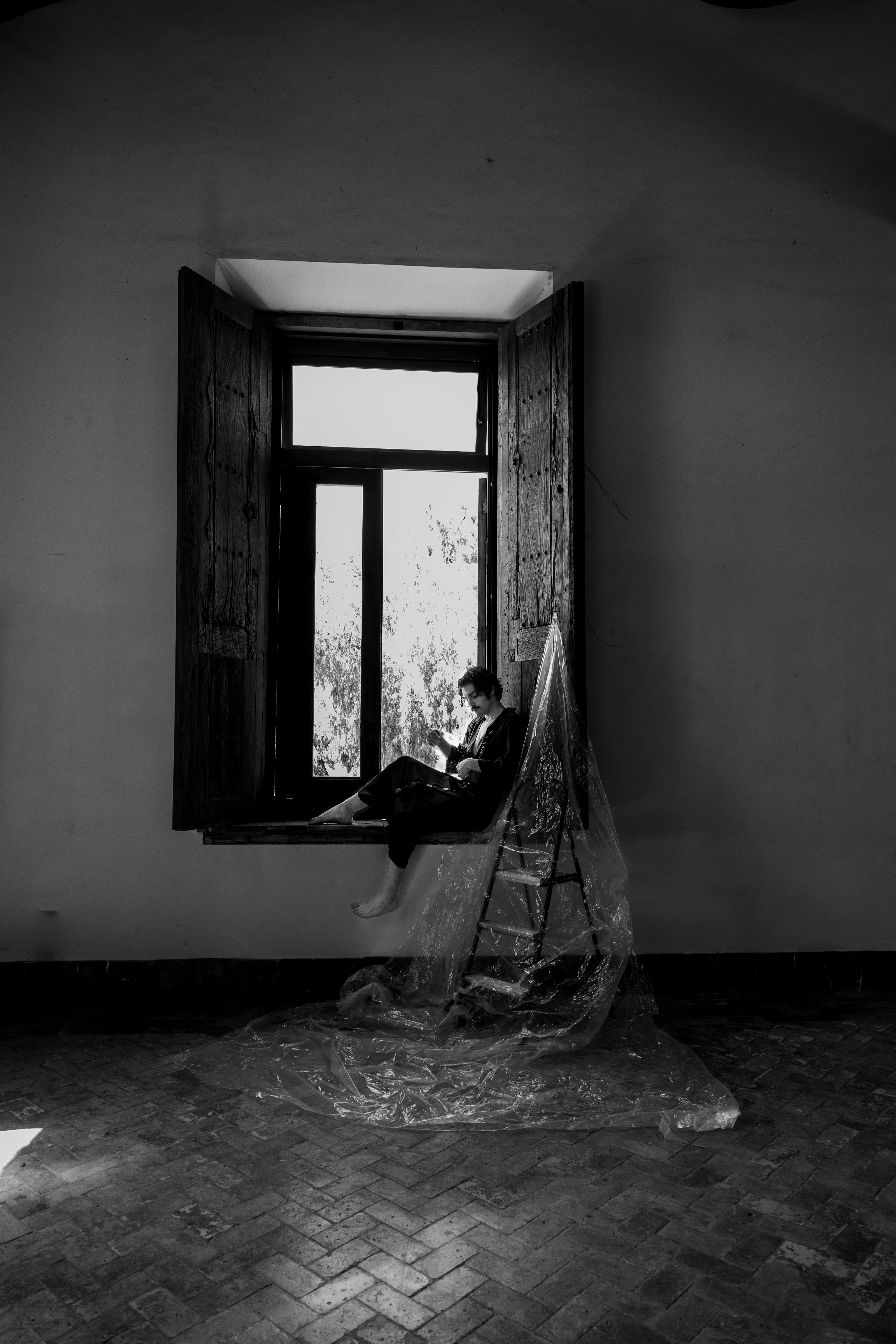 Contemplative Moment by the Window · Free Stock Photo