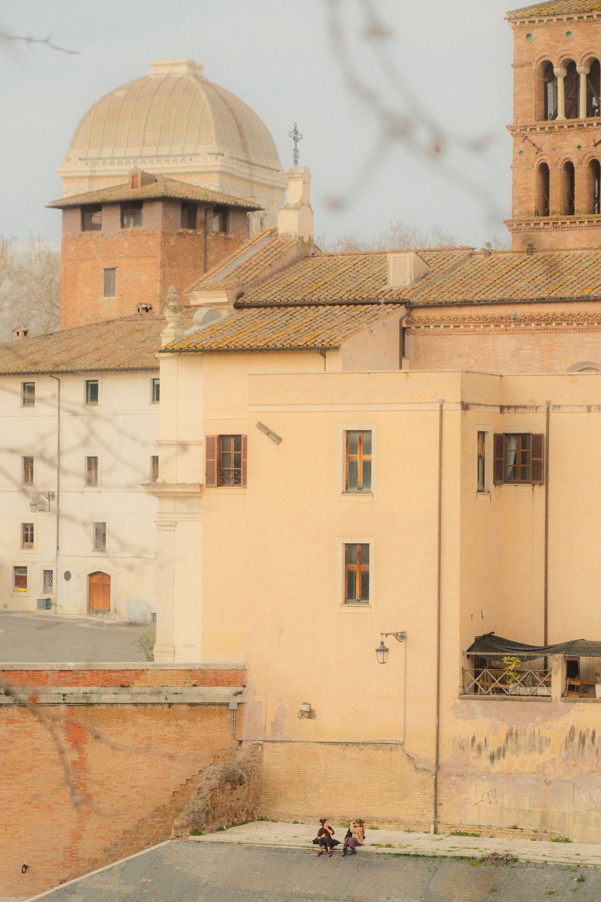 Atmospheric view of classic European architecture in soft, warm tones.