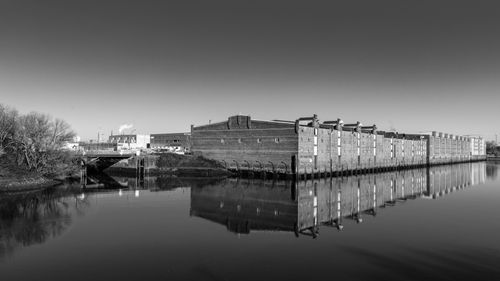 Free Black and white photo of historic brick architecture by the river in Hamburg, Germany. Stock Photo