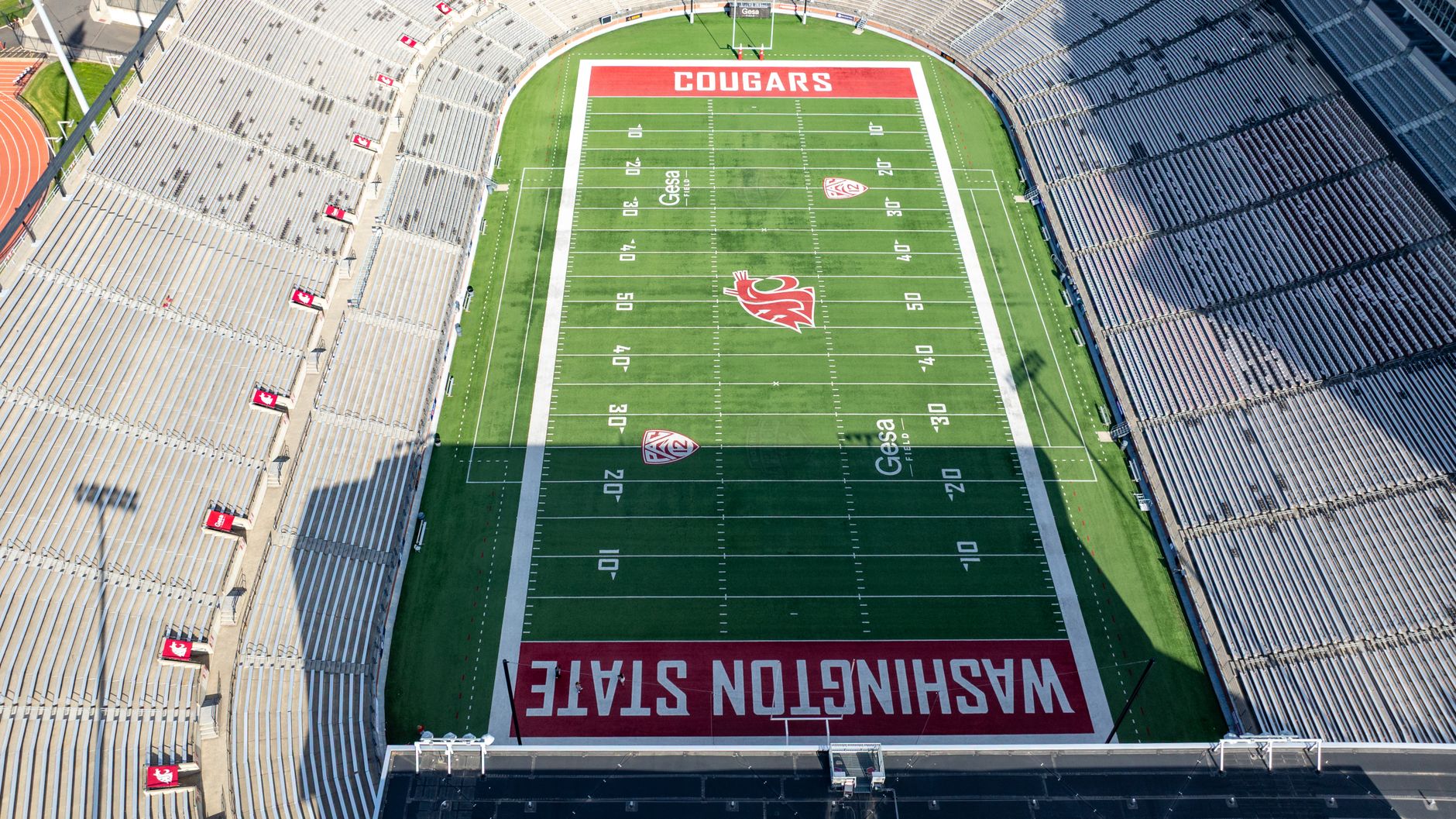 Aerial shot of Washington State University's football stadium, beautifully capturing the green field and empty stands.