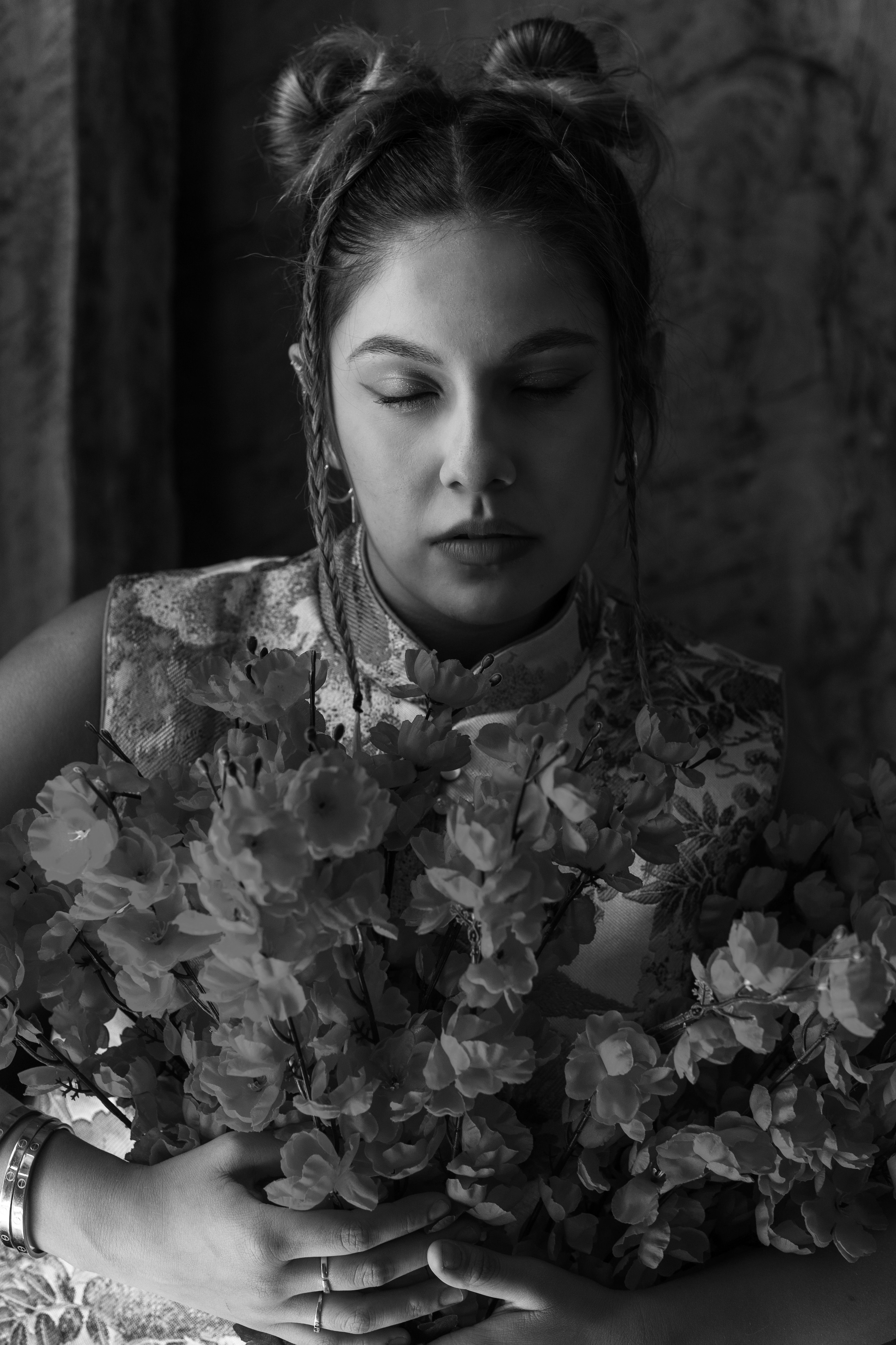 Elegant Woman Posing with Flowers in Black and White · Free Stock Photo