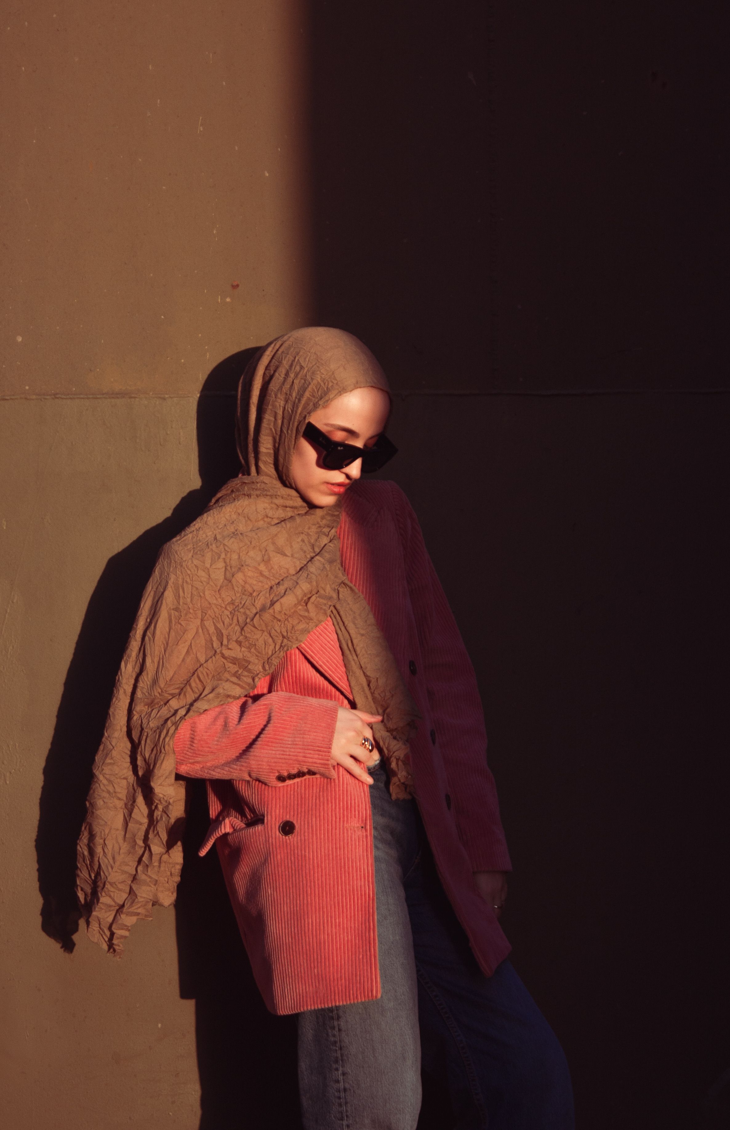 Stylish Woman in Hijab Posing Against Wall · Free Stock Photo