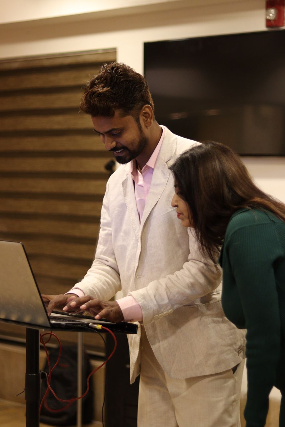 Indian designer and developer collaborating on a website