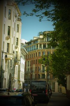 Charming European street view with classic architecture and urban life.