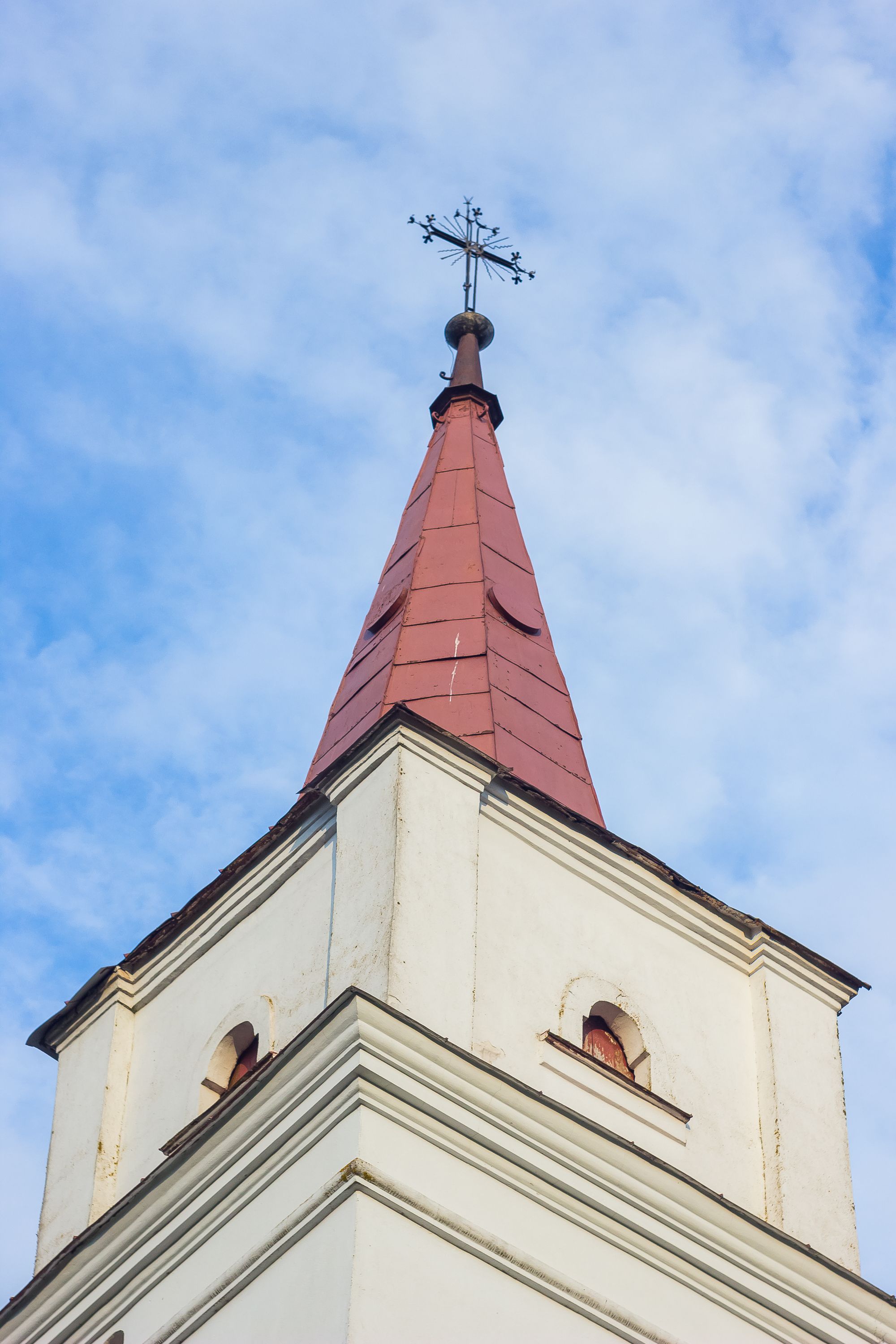 Gothic Church Tower with Cross Against Blue Sky · Free Stock Photo