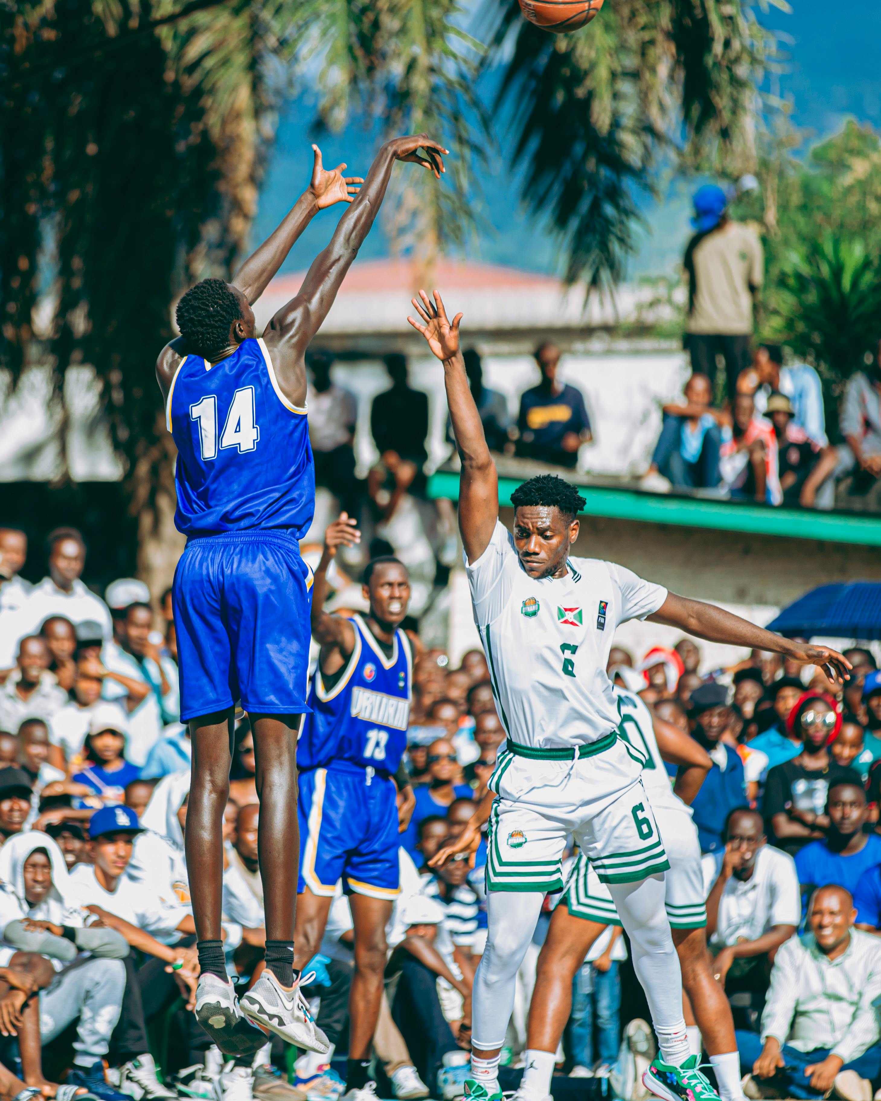 Basketball game action with energetic crowd