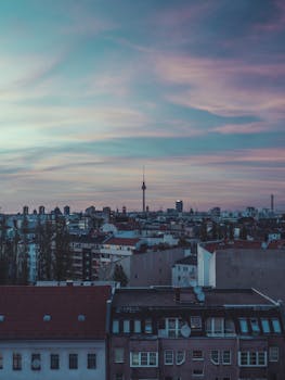 Aerial view of Berlin's skyline with TV Tower during a colorful sunset.