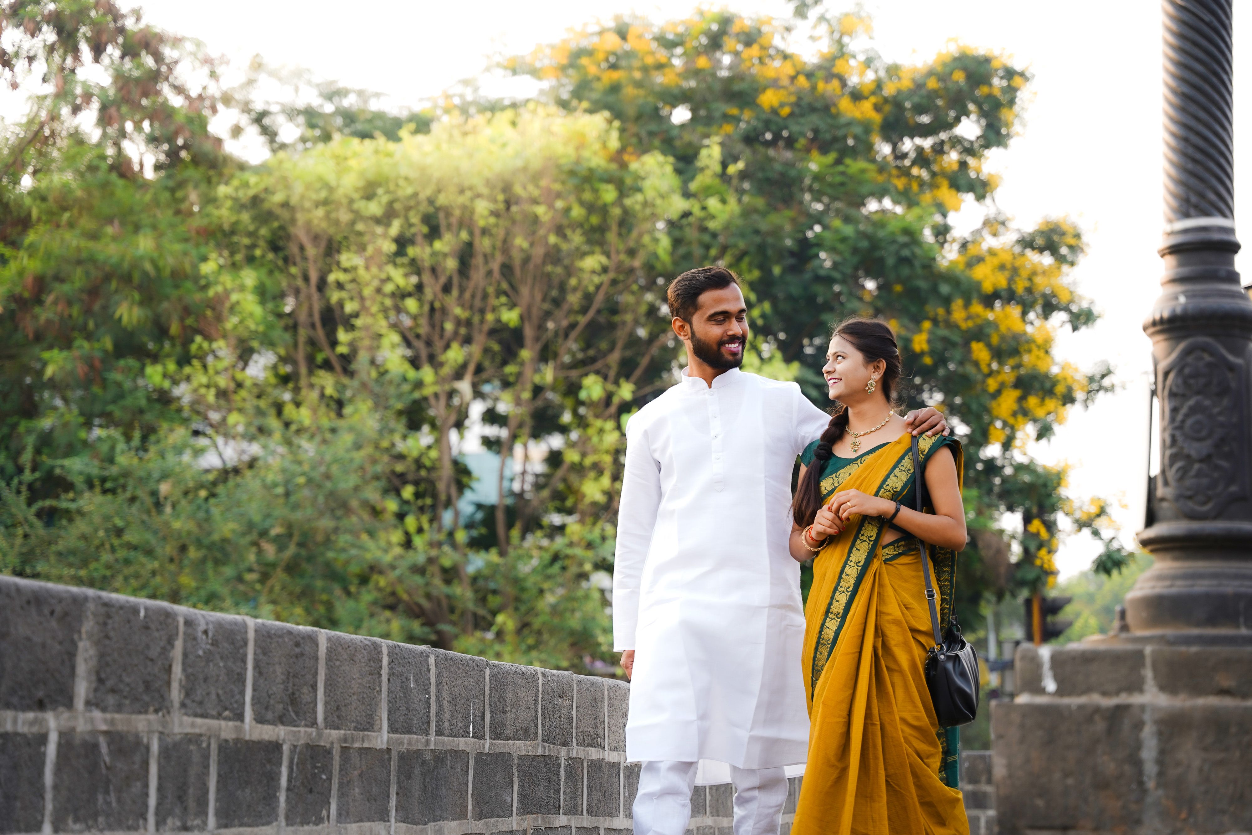 Happy Indian Couple Strolling Outdoors · Free Stock Photo