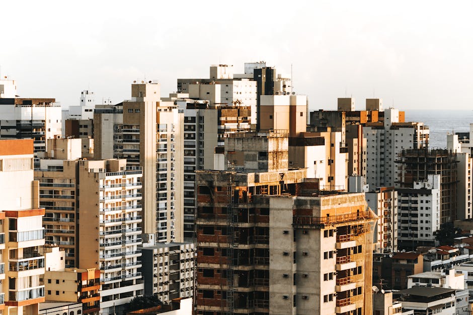Aerial view of diverse urban architecture with high rise buildings in daylight.