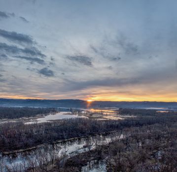 A stunning winter sunrise over the flooded wetlands in Nelson, Wisconsin, USA.