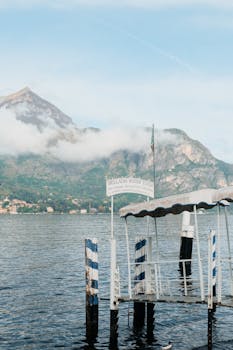 View of Bellagio water taxi dock with mountains in the background at Lake Como.