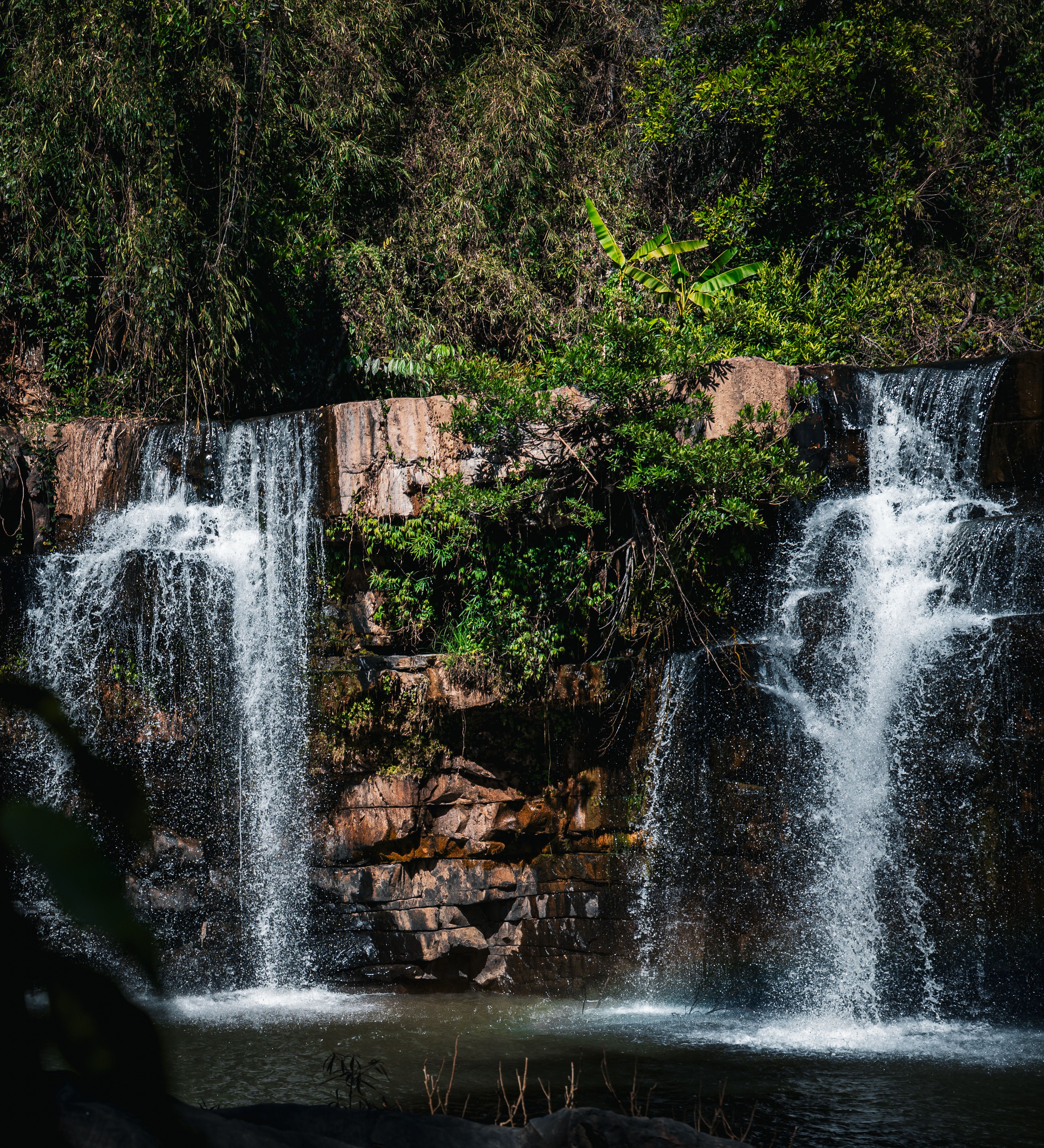 Stunning twin waterfall cascading in a lush Thailand jungle.