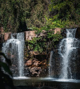 Stunning twin waterfall cascading in a lush Thailand jungle.