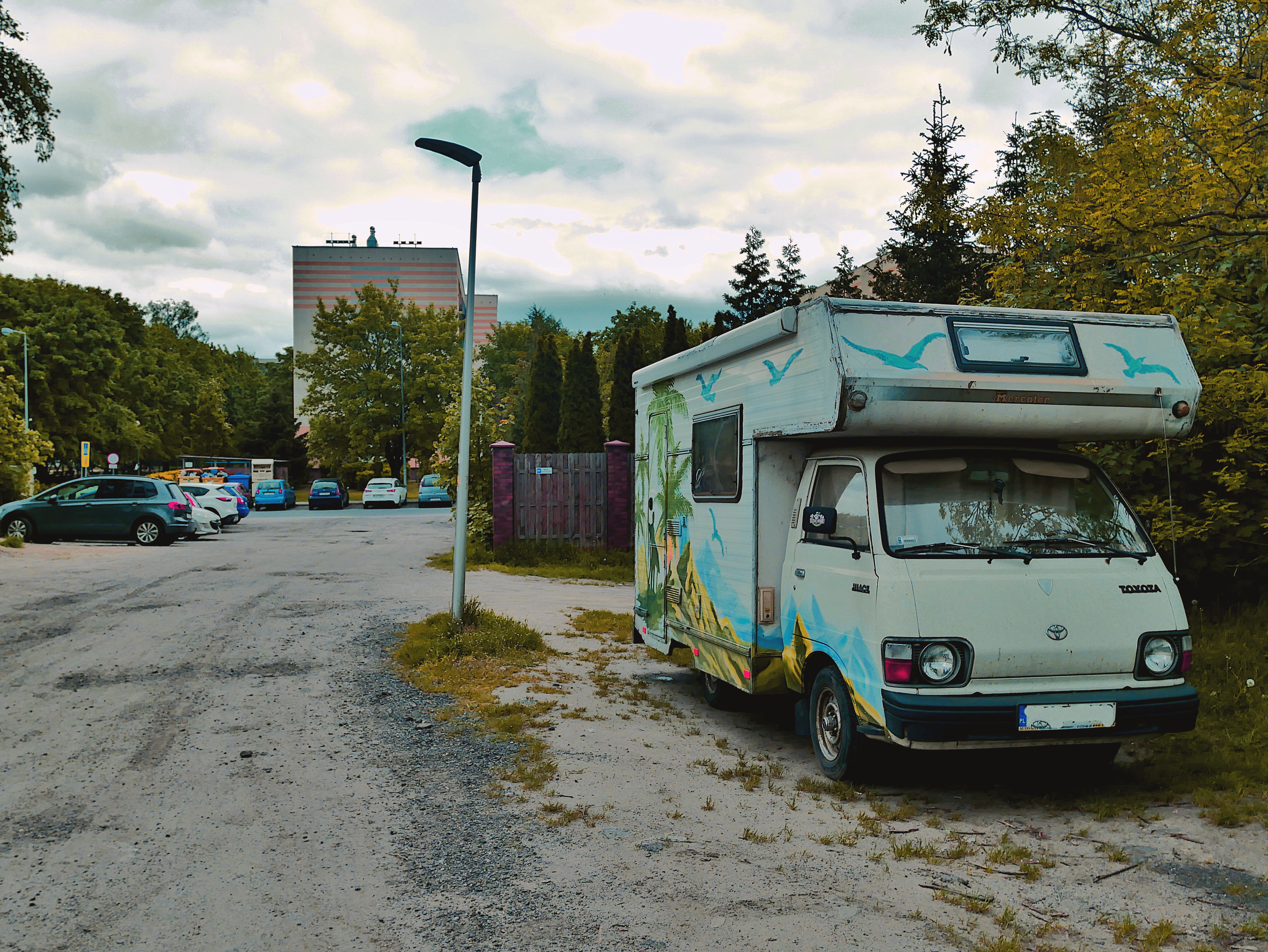 Vintage Camper Van Parked in Urban Setting · Free Stock Photo