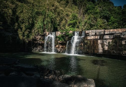 Stunning view of a lush forest waterfall in Thailand, perfect for nature lovers.