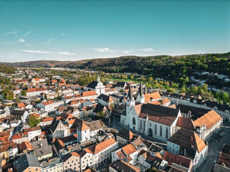 A beautiful aerial overview of Eichstätt, showcasing its historic architecture against a vibrant spring backdrop.