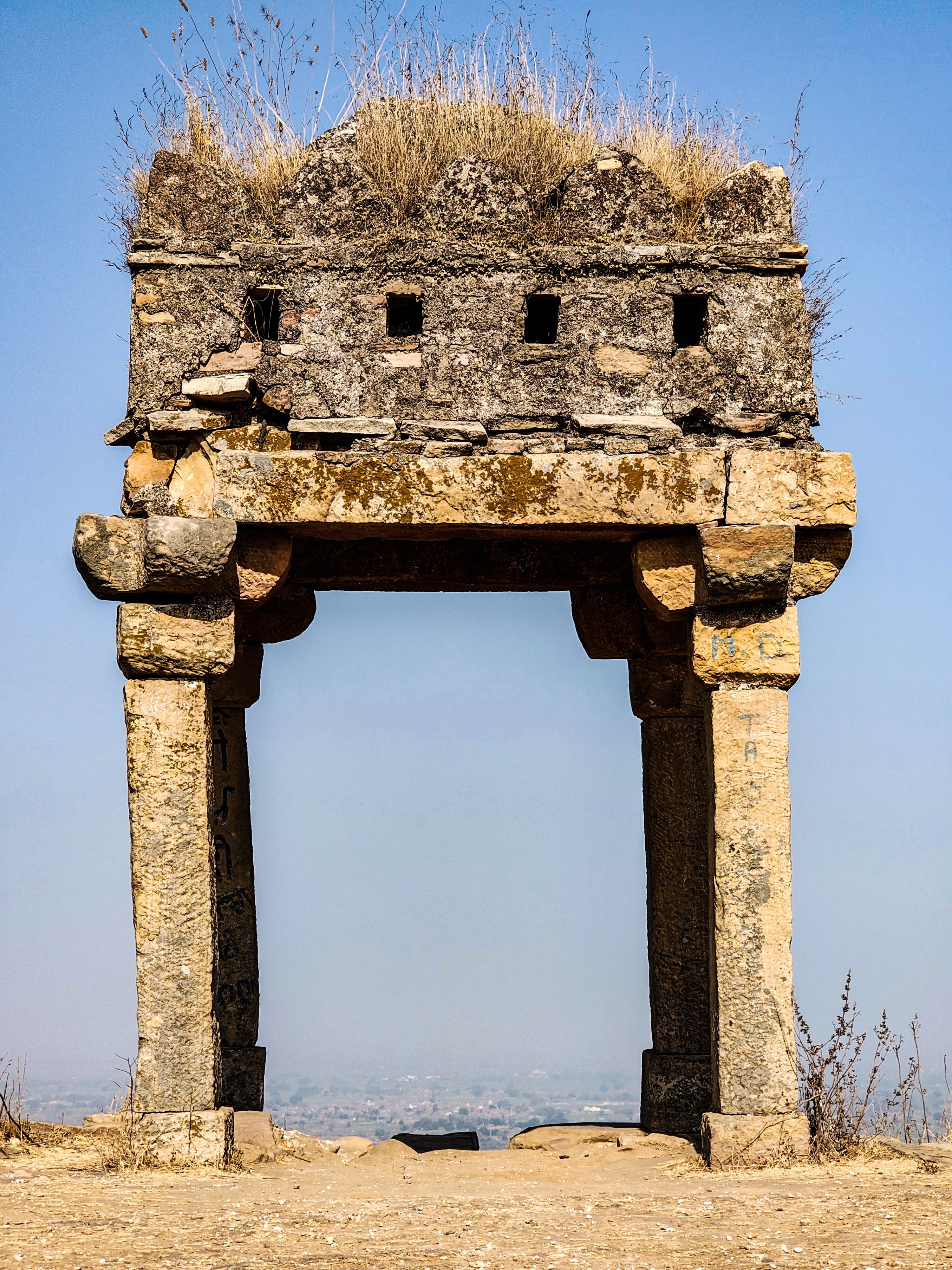 Ancient Stone Gate Ruins under Clear Blue Sky · Free Stock Photo