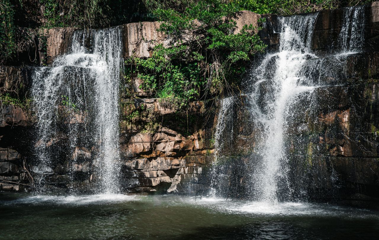stunning twin waterfalls cascading in a verdant thai forest landscape
