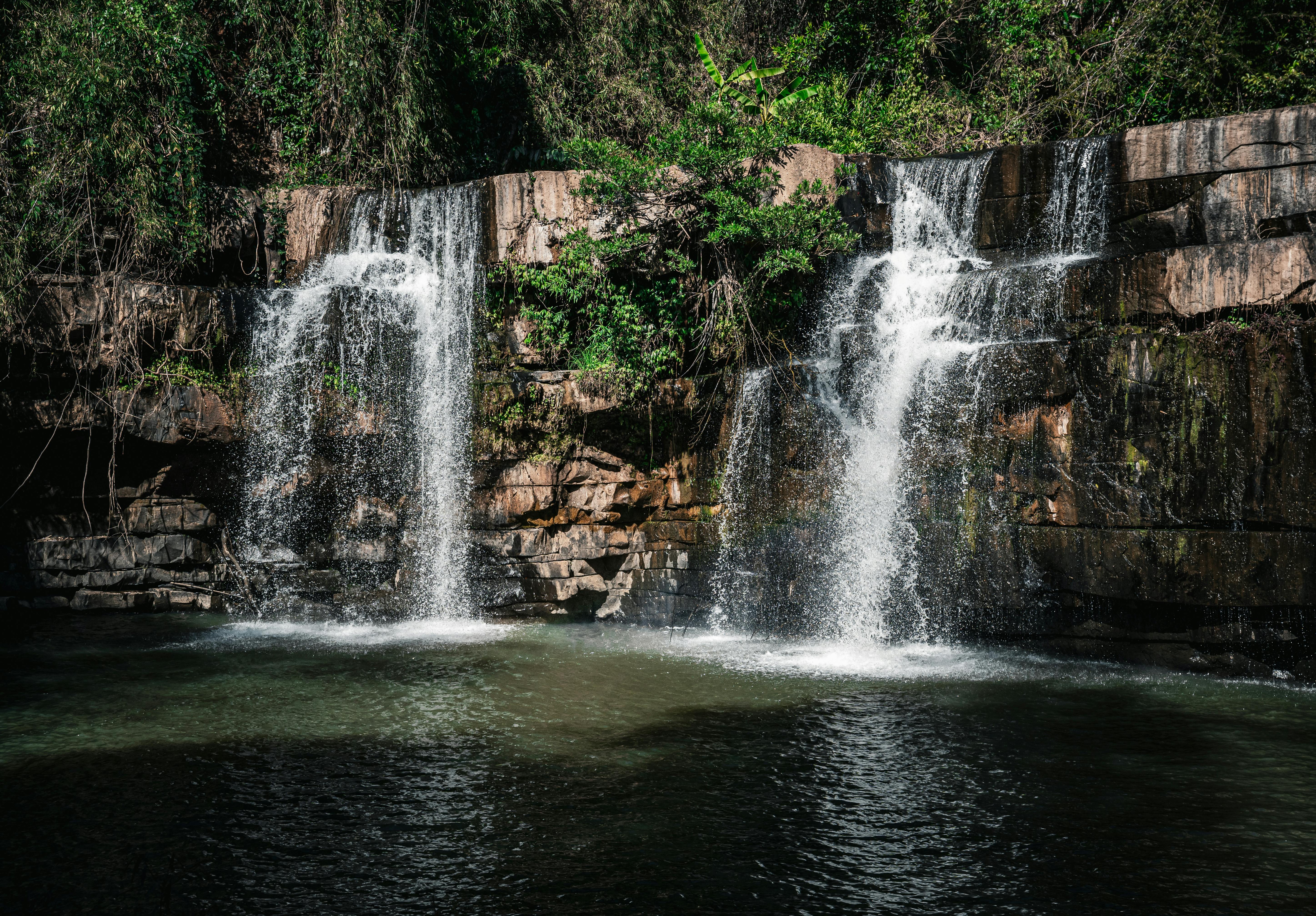 Beautiful cascading waterfall in a lush forest setting in Thailand. Perfect for nature lovers.