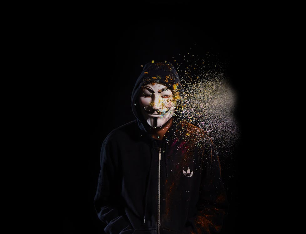 Free Person Wearing Black Hoodie and Mask Stock Photo