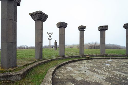 Free Stone columns in Mtskheta-Mtianeti, Georgia, under a cloudy sky, capturing the ancient architecture. Stock Photo