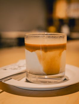 A beautifully crafted latte in a tranquil Japanese setting, perfect for coffee lovers.