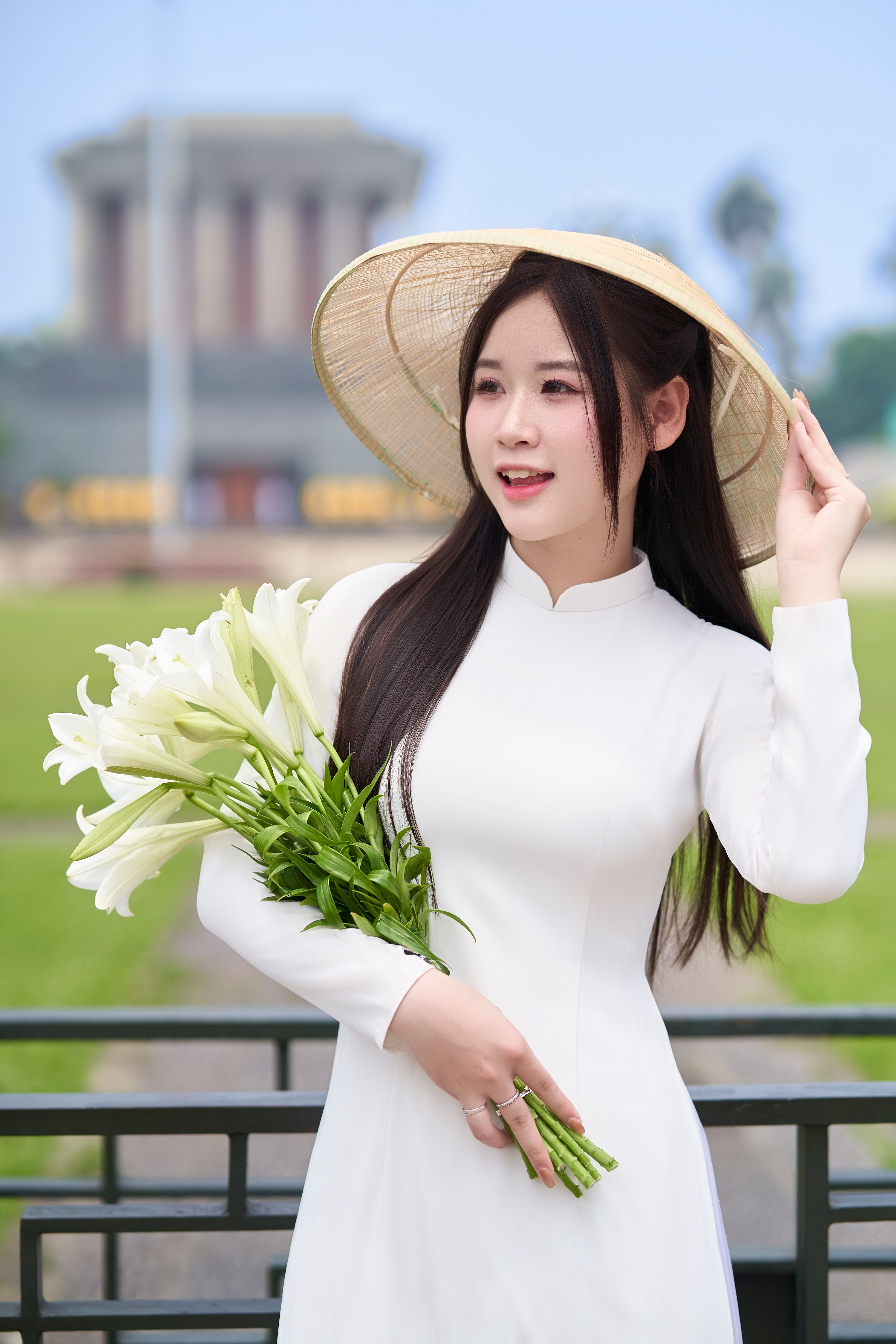 Woman in Traditional Dress with Flowers Outdoors · Free Stock Photo