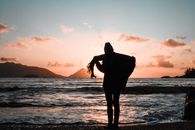 Silhouette of Woman Standing on the Seashore