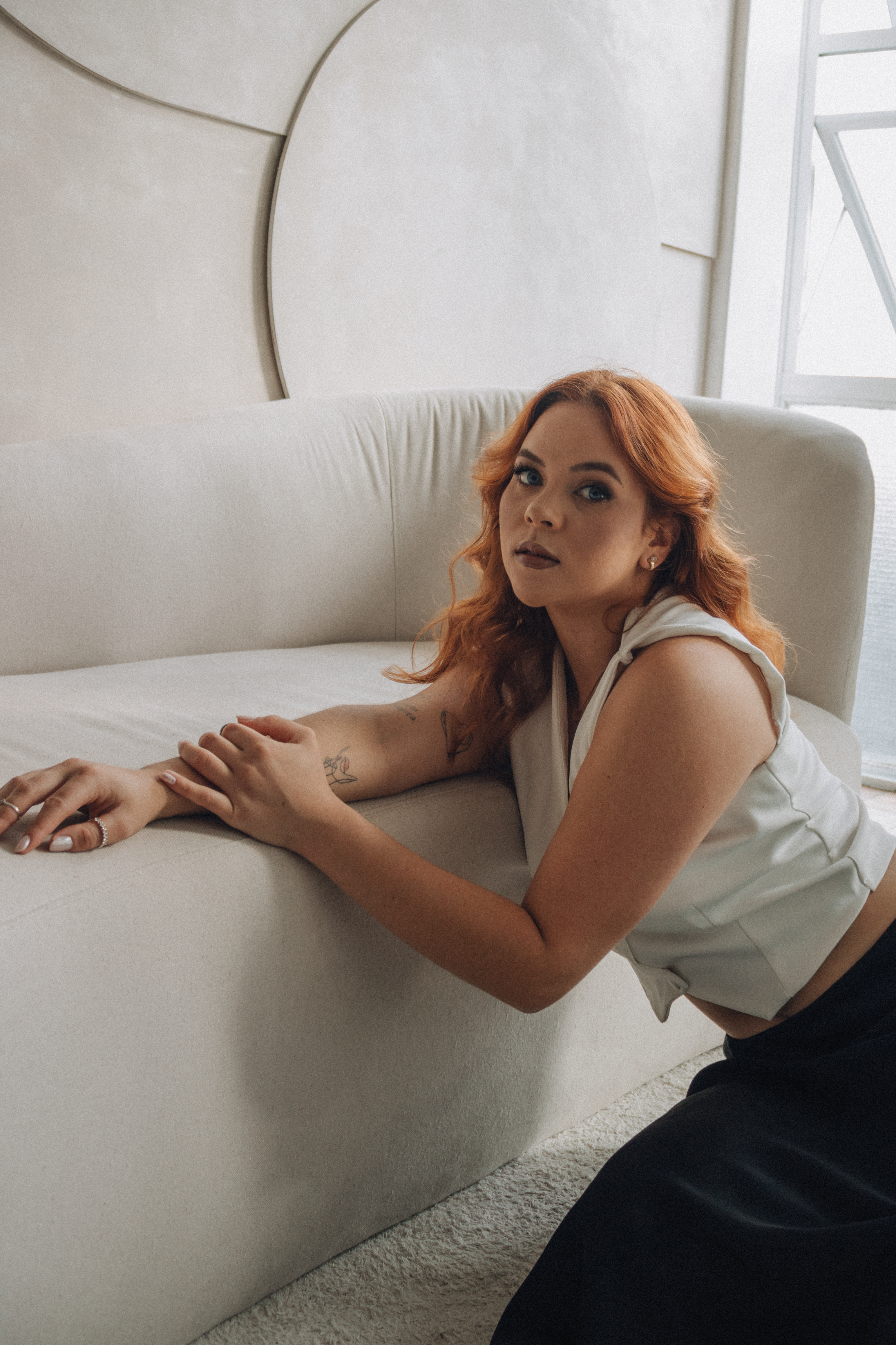 Stylish Woman Posing in Modern Interior Setting · Free Stock Photo