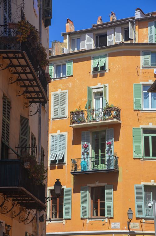 Free Colorful historic building in Old Town Nice, Provence, France, under a bright blue sky. Stock Photo